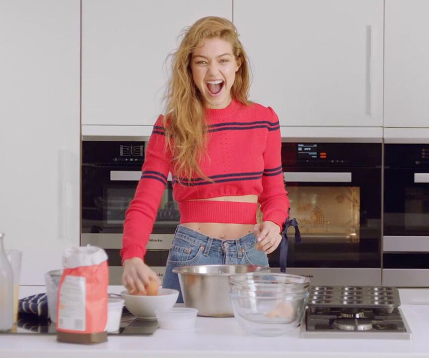 A slim girl prepares herself a healthy breakfast